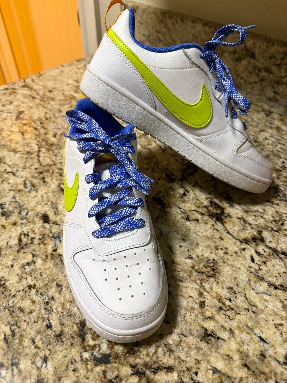Nike Kids White Sneakers with Lime Swoosh and Blue Accents